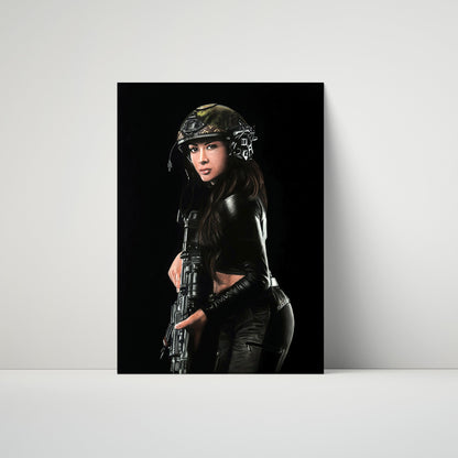 A vertical art print or poster leaning against a light gray wall on a white surface. The print shows a woman in tactical gear and a helmet holding a rifle against a black background.