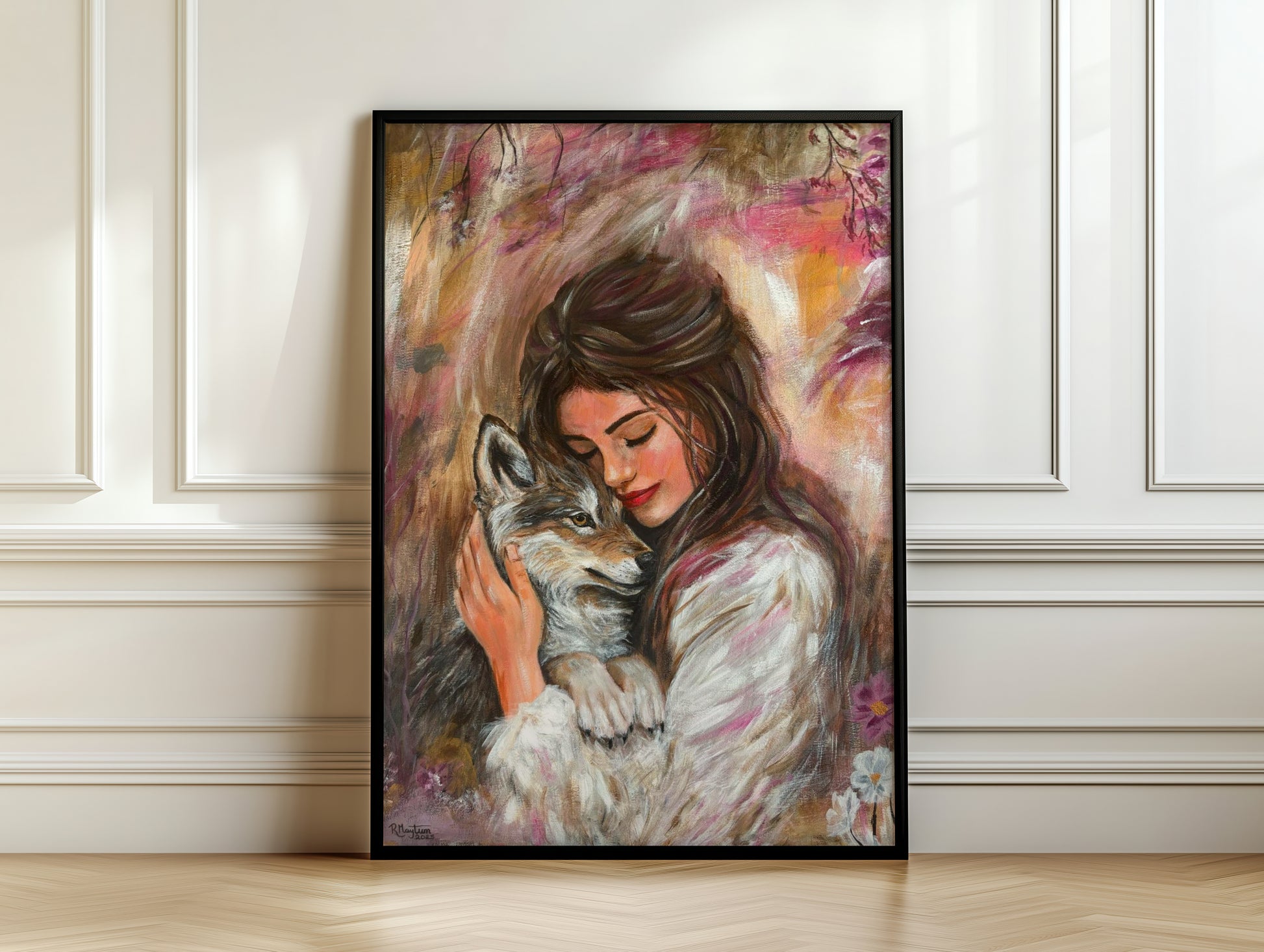 Framed artwork of a woman hugging a wolf against a decorative wall.
