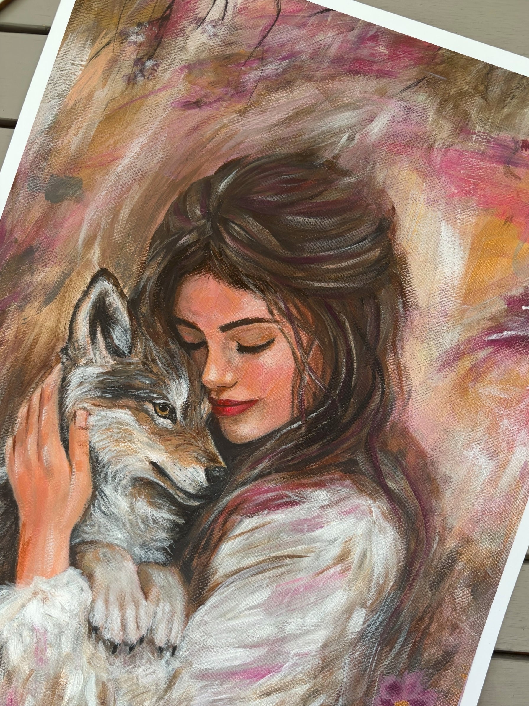 Artistic depiction of a woman hugging a wolf with a soft, warm color palette.